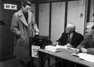 A Coventry voter casts his vote in the 1959 General Election at Cheylesmore polling