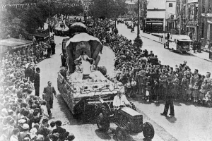 00447 Prints: Coventrys Coronation Carnival procession with the main tableau carrying the carnival