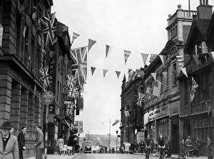 Bunting Prints: Coventrys High Street looking towards Earl Street is festooned with flags for the VE