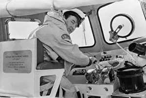 Coxswain Mr. Frank Tinsley seated at the controls of the Barry lifeboat during an