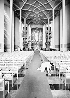 Craftsmen put the finishing touches to the new Coventry Cathedral which stands alongside