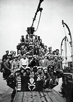 Navy Prints: The crew of HMS Sportsman pose on the deck of their submarine at a un-named Northern