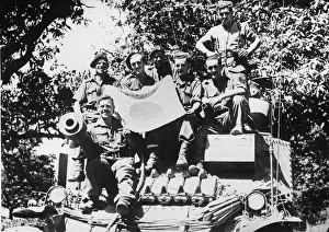 01456 Prints: The crew of a Lee tank pose with a captured Japanese flag during the advance south of