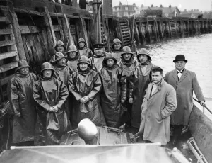 Accidents Prints: Crew of a lifeboat in Gorleston-on-Sea station on the Norfolk coast. Cox C. J