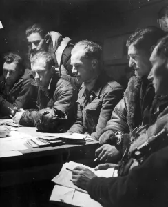 00411 Prints: The crew of an RAF Stirling bomber interrorgated after their return from a big raid