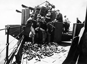00411 Prints: The crew of a Royal Navy destroyers anti-aircraft gun enjoying a cigarette break