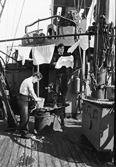 00095 Prints: Two of the crew of a Royal Navy minesweeper on coastal convoy duties off the south west