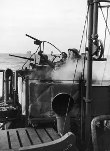00095 Prints: Crew of a Royal Navy minesweeper seen here at action stations during coastal convoy duty