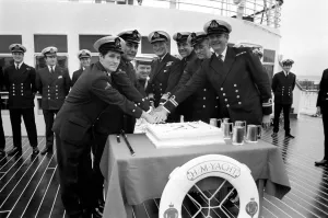 Cutting Prints: The crew of the Royal Yacht Britannia celebrate the crafts 21st Birthday