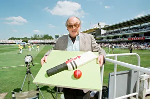 Cricket commentator Henry Blofeld is presented with a Daily Mirror cake in the shape of a