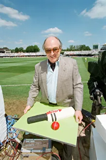 Cricket commentator Henry Blofeld is presented with a Daily Mirror cake in the shape of a