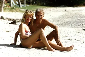 Cricketer David Gower cricketer with girlfriend Thorrun Nash on the beach during their