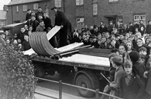 00172 Prints: A crowd of excited yougsters watch the delivery of the first consignment of A. R. P