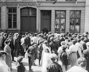 Belgium Prints: A crowd gather outside a house being searched for German spies by the police