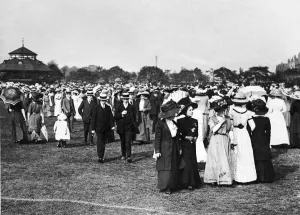 Suits Prints: Crowd of people out for a walk in their Sunday Best at Birchfields Park in Rusholme