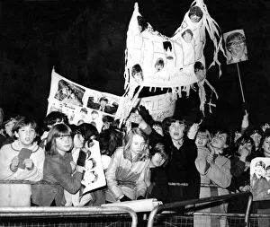 A crowd of screaming Beatles fans waiting outside the Capitol Cinema