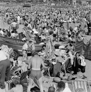 Crowded beach at Margate with holiday makers enjoying the sun. 4th August 1964