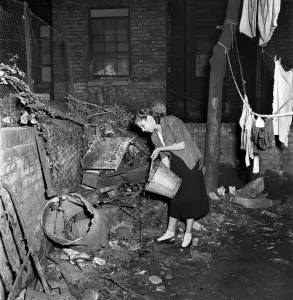 Sanitation Prints: Crowded home. Slums in Paddington - condemned house with no lavatory