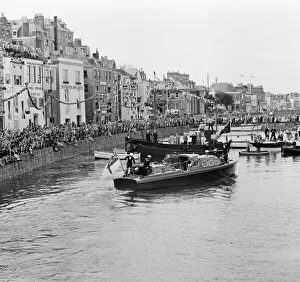 Bunting Prints: Crowds await the arrival of Her Majesty Queen Elizabeth II at St Peter Port in Guernsey