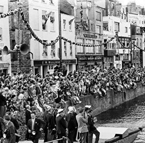 Bunting Prints: Crowds await the arrival of Her Majesty Queen Elizabeth II at St Peter Port in Guernsey
