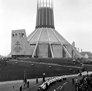 Cathedral Prints: Crowds follow the Knights of St Gregory as the procession moves off in Liverpool