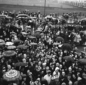 01071 Prints: Crowds gather in the rain to catch a glimpse of Prime Minister Harold Wilson (1916 - 1995