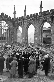Service Prints: Crowds gather for a service inside the ruins of Coventry Cathedral after it was destroyed
