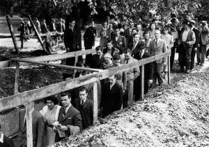 Shelter Prints: Crowds make their way down to an underground shelter as the air raid siren sounds minutes