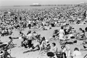 00585 Prints: Crowds pack the Central beach at Blackpool on a hot summers day, Lancashire