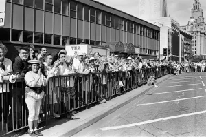 Crowds of people line the dock road set for a day out at Liverpool Albert Dock to see