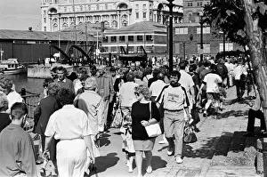 01311 Prints: Crowds of people line the dock road set for a day out at Liverpool Albert Dock to see
