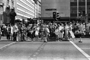 Crowds of people line the dock road set for a day out at Liverpool Albert Dock to see
