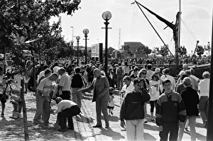 01311 Prints: Crowds of people line the dock road set for a day out at Liverpool Albert Dock to see