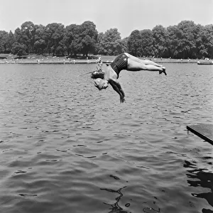 Crowds sunbathing at Serpentine Lido, Hyde Park, London
