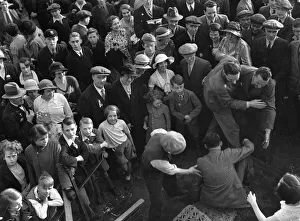 00079 Prints: Crowds watching the Carnival parade through Kingston in celebration of King George V