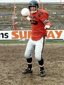 Helmet Prints: Crystal Palace FC. Manager Malcolm Allison in American Football kit. April 1976