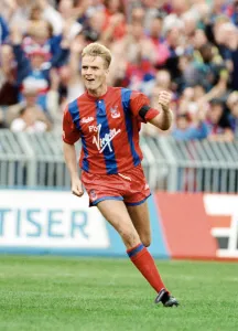 Arms Raised Prints: Crystal Palace footballer Geoff Thomas celebrates after scoring a goal in the league