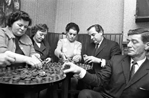 Currency Prints: Cubbington personality girl Miss Susan Rogers pushed over a pile of pennies built
