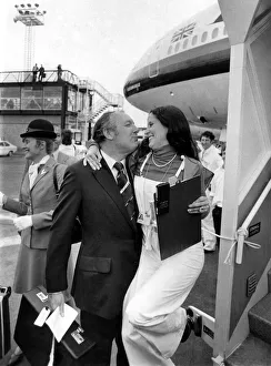 Stewardess Prints: A cuddle for the cut-price king Freddie Laker from a Gatwick hostess