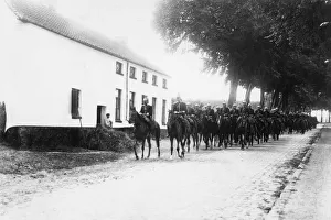 00539 Prints: The Cuirassiers of the French cavalry seen here passing through a Belgium village during