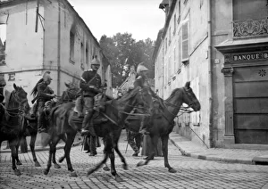 Burnt Out Buildings Prints: The Cuirassiers of the French cavarly seen here passing through the ruins of Senlis a