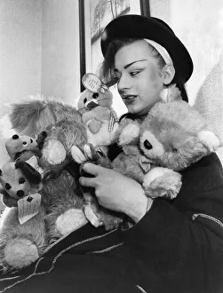 00357 Prints: Culture club lead singer boy George with his cuddly toys he has saved from his fans