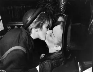 Man And Woman Prints: Culture club lead singer boy George kisses one of his look-alike fans as he leaves