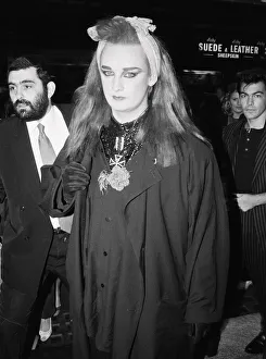 Hairstyle Prints: Culture Club singer Boy George arriving at a film premiere. 3rd October 1984