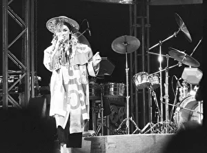 Hairstyle Prints: Culture Club singer Boy George performing on stage during a concert