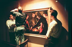 Painting Prints: Curator, Julian Herbert (left) supervises the removal of The Dice Players