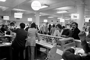 Images Dated 19th April 1975: Customers at the Cash Desk in the Electrical section of Selfridges during a sale