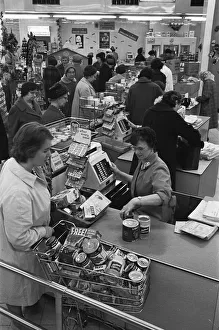 Sign Prints: Customers at the checkout counter of the Nottingham Co-Op supermarket. 1st May 1963