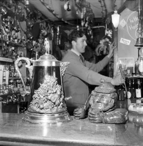 The customers of the Old Turkey Cock pub near Hunston in Herts. 1956 A273