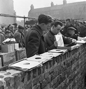 Men Only Prints: Customers at the secondhand gramophone record stall at the flea market in Club Row